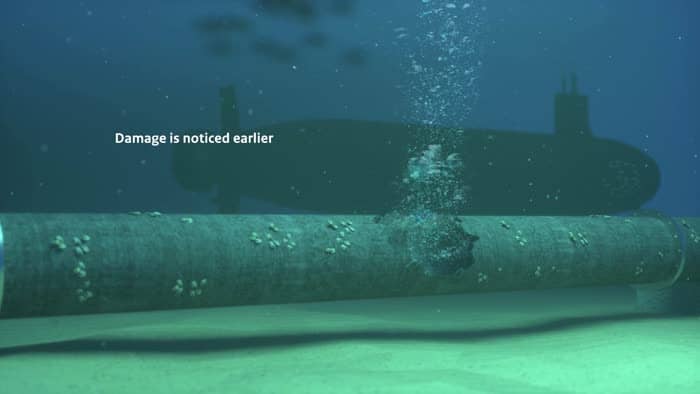 Offshore buoy in the North Sea, with the sea and wind turbines in the background, used as a visual representing the digitalisation and maintenance of energy infrastructure.